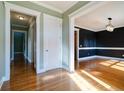Bright hallway with hardwood floors and access to other rooms at 7290 Lockford Walk N, Avon, IN 46123