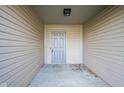 Gray front door leading into covered entryway at 8391 Inland Dr, Avon, IN 46123
