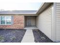 Gray front door entry with brick and siding exterior at 8391 Inland Dr, Avon, IN 46123
