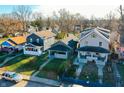 Three houses in a row, two grey and one light beige at 951 W 33Rd St, Indianapolis, IN 46208