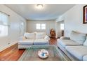 Living room with hardwood floors, two sofas, and a coffee table at 951 W 33Rd St, Indianapolis, IN 46208