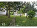 Landscaped backyard with a stone pathway at 1519 E Mills Ave, Indianapolis, IN 46227