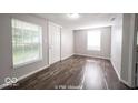 Bright living room with hardwood floors and neutral walls at 1519 E Mills Ave, Indianapolis, IN 46227