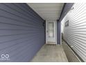 Side entrance with a covered walkway leading to the front door at 907 S East St, Indianapolis, IN 46225