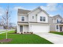 Two-story house with gray siding, white trim, and a two-car garage at 1122 Lona Dr, Martinsville, IN 46151