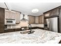 Modern kitchen with stainless steel appliances and an island at 6015 S State Road 75, Coatesville, IN 46121