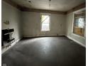 Empty bedroom with damaged walls and exposed floors, ready for renovation at 1210 N Rural St, Indianapolis, IN 46201