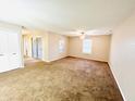 Spacious carpeted bedroom with large window and closet at 1632 Wellesley Ct # 6, Indianapolis, IN 46219