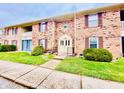 Brick building exterior with landscaping and walkway at 1632 Wellesley Ct # 6, Indianapolis, IN 46219