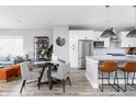 Modern kitchen with white cabinets, stainless steel appliances, and a kitchen island at 457 Shade St, Carmel, IN 46290