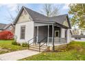 Charming craftsman home, featuring a gray porch and landscaping at 700 S Ohio St, Sheridan, IN 46069