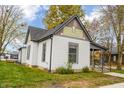 Side view of charming craftsman home with gray accents at 700 S Ohio St, Sheridan, IN 46069