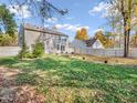 Spacious backyard with a fenced perimeter and mature trees at 11411 Shady Hollow Ln, Indianapolis, IN 46229
