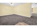 Bright living room with neutral walls and carpeting at 11411 Shady Hollow Ln, Indianapolis, IN 46229