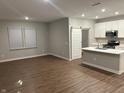 Open concept kitchen with island and stainless steel appliances at 1202 Langham St, Avon, IN 46123