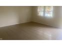 Living room with tile floor and large window at 3936 Delmont Dr, Indianapolis, IN 46235