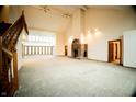 Spacious living room with high ceilings and fireplace at 4257 Tattersall Dr, Plainfield, IN 46168