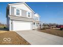 Two story gray house with white accents and a two car garage at 6712 Firkins Dr, Indianapolis, IN 46221