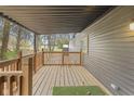 Wooden deck with railing and artificial turf at 71 E Cove Ct, Cicero, IN 46034