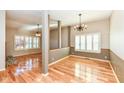 Spacious dining room with hardwood floors and chandelier at 19214 Amber Way, Noblesville, IN 46060