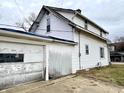 White sided detached garage with single door at 310 S Pleasant St, Edinburgh, IN 46124