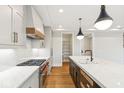 Modern kitchen with island, white and dark cabinets, and a walk-in pantry at 41 N Rangeline Rd # 7, Carmel, IN 46032