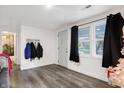 Bright entryway with gray vinyl plank flooring and coat hooks at 6944 W 800 N, Fairland, IN 46126