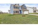 Landscaped lawn with a two-story home in the background at 1782 N Clearwater Dr, Greenfield, IN 46140