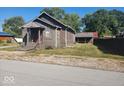 Charming bungalow with stone accents, front porch, and a spacious yard at 306 E Cherry St, Advance, IN 46102