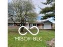 Brick ranch house with attached garage and landscaped yard at 11 S 1050 W, Jamestown, IN 46147