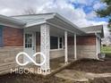 Brick ranch house with attached garage and landscaped yard at 11 S 1050 W, Jamestown, IN 46147
