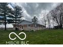 Brick ranch house with attached garage and landscaped yard at 11 S 1050 W, Jamestown, IN 46147