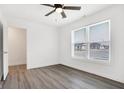 Spacious bedroom featuring wood-look floors and a large window at 1492 Coen Ct, Columbus, IN 47201