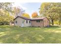Ranch home with a spacious backyard and storage shed at 408 N Sherwood Dr, Muncie, IN 47304