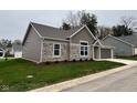 Rear view of the house highlighting the stone and siding at 4204 W Palomino Ct, Muncie, IN 47304