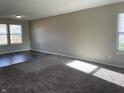 Living room featuring neutral walls and gray carpeting at 7530 Redcliff Rd, Indianapolis, IN 46256