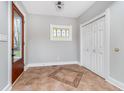 Inviting entryway with tile flooring and stained glass window at 1423 Hoyt Ave, Indianapolis, IN 46203