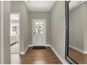 Bright foyer with wood-look floors and access to a bedroom at 1829 Grand Vista Blvd, Greenwood, IN 46143