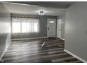 Bright living room featuring gray walls and wood-look flooring at 236 Pam Rd, Carmel, IN 46280