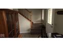 Entryway with carpeted stairs, tiled floor, and wooden cabinet at 636 Creston Point Cir, Indianapolis, IN 46239