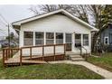 White house with porch, ramp, and small yard at 1708 S Randolph St, Indianapolis, IN 46203