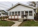 White house with porch, ramp, and small yard at 1708 S Randolph St, Indianapolis, IN 46203