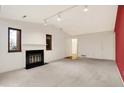 Living room featuring a fireplace and an accent wall at 9296 Oak Run Cir, Indianapolis, IN 46260