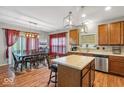 Spacious kitchen with an island and hardwood floors at 11624 N Creekside Dr, Monrovia, IN 46157