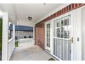 Front entrance with security door and white trim at 11736 Grazing Ln, Indianapolis, IN 46239