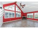Spacious living room with vaulted ceiling, fireplace and large windows at 11736 Grazing Ln, Indianapolis, IN 46239