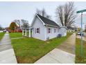 Gray siding house with a covered porch and a side yard at 31 S Superior St, Orestes, IN 46063