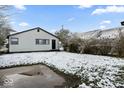 Snowy backyard with a view of the back of the house at 50 Mckinley St, Shelbyville, IN 46176