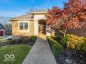 Inviting front entrance with walkway and landscaping at 12954 Water Ridge Dr, Fishers, IN 46055