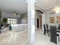 Spacious living room with high ceilings and a view of the dining area at 12954 Water Ridge Dr, Fishers, IN 46055